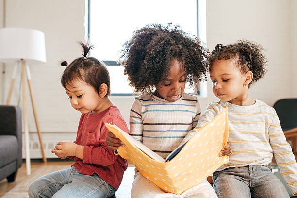 Children sharing a book