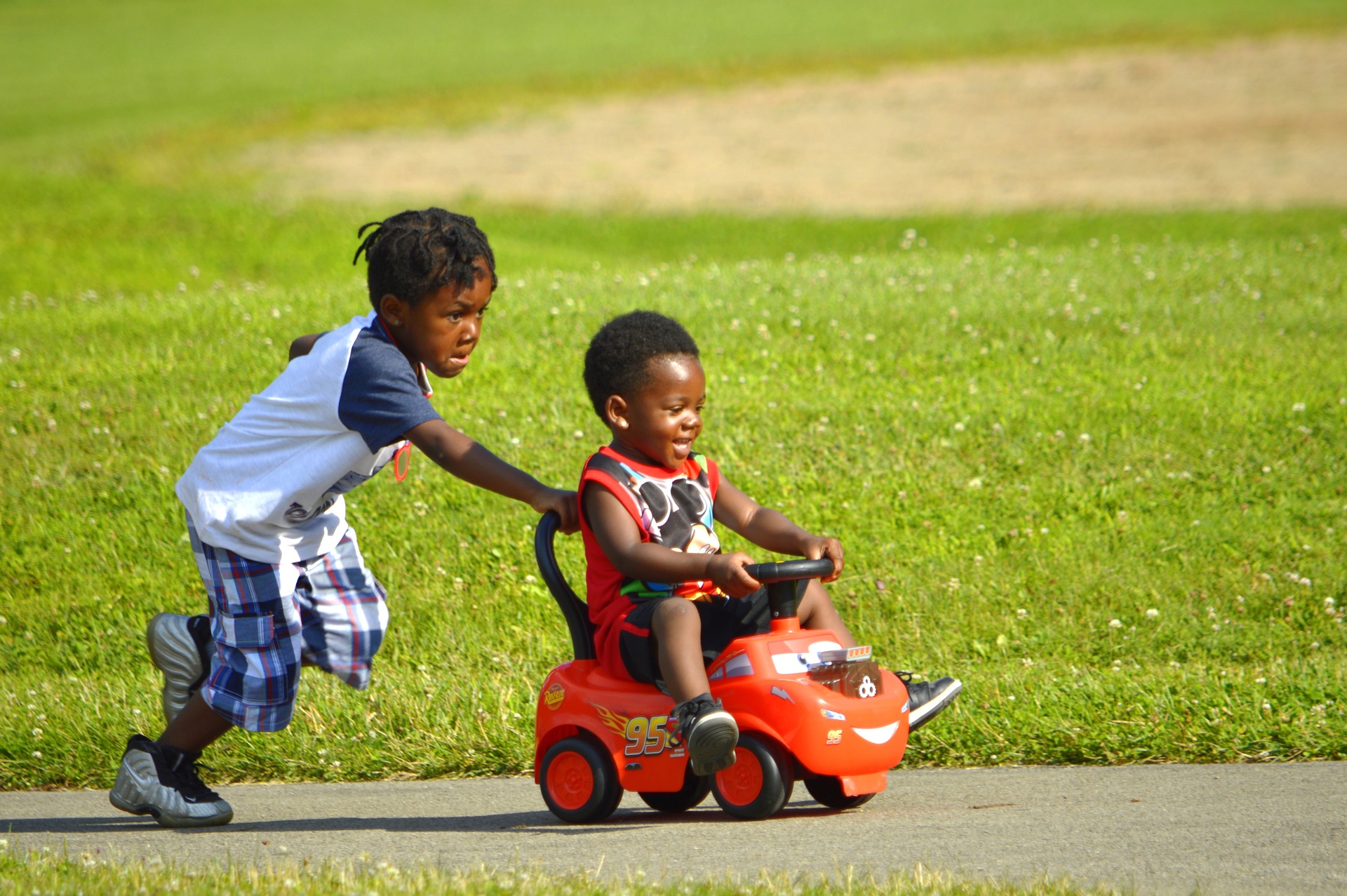 children sharing a vehicle