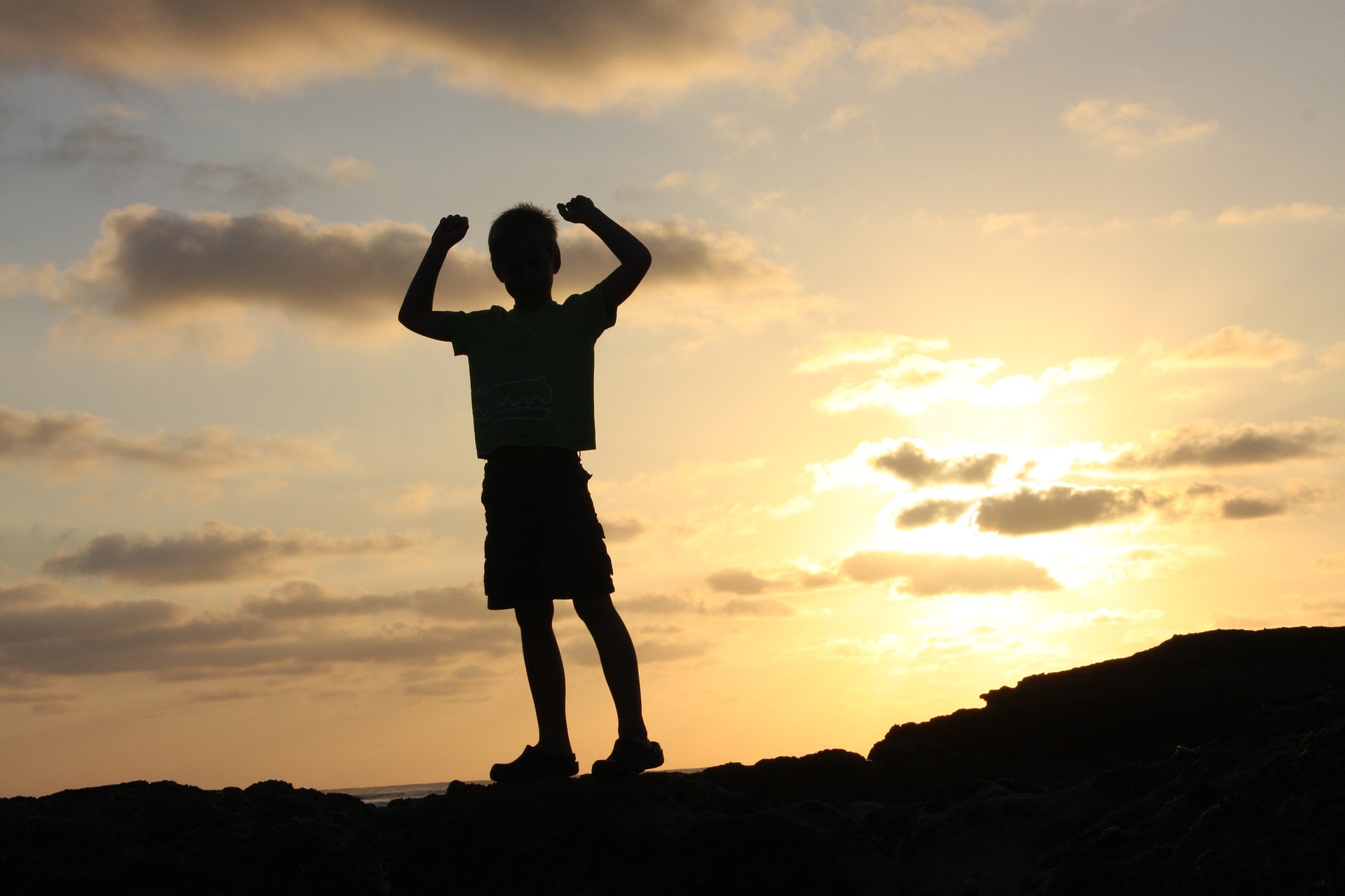 Silhouette of a child celebrating