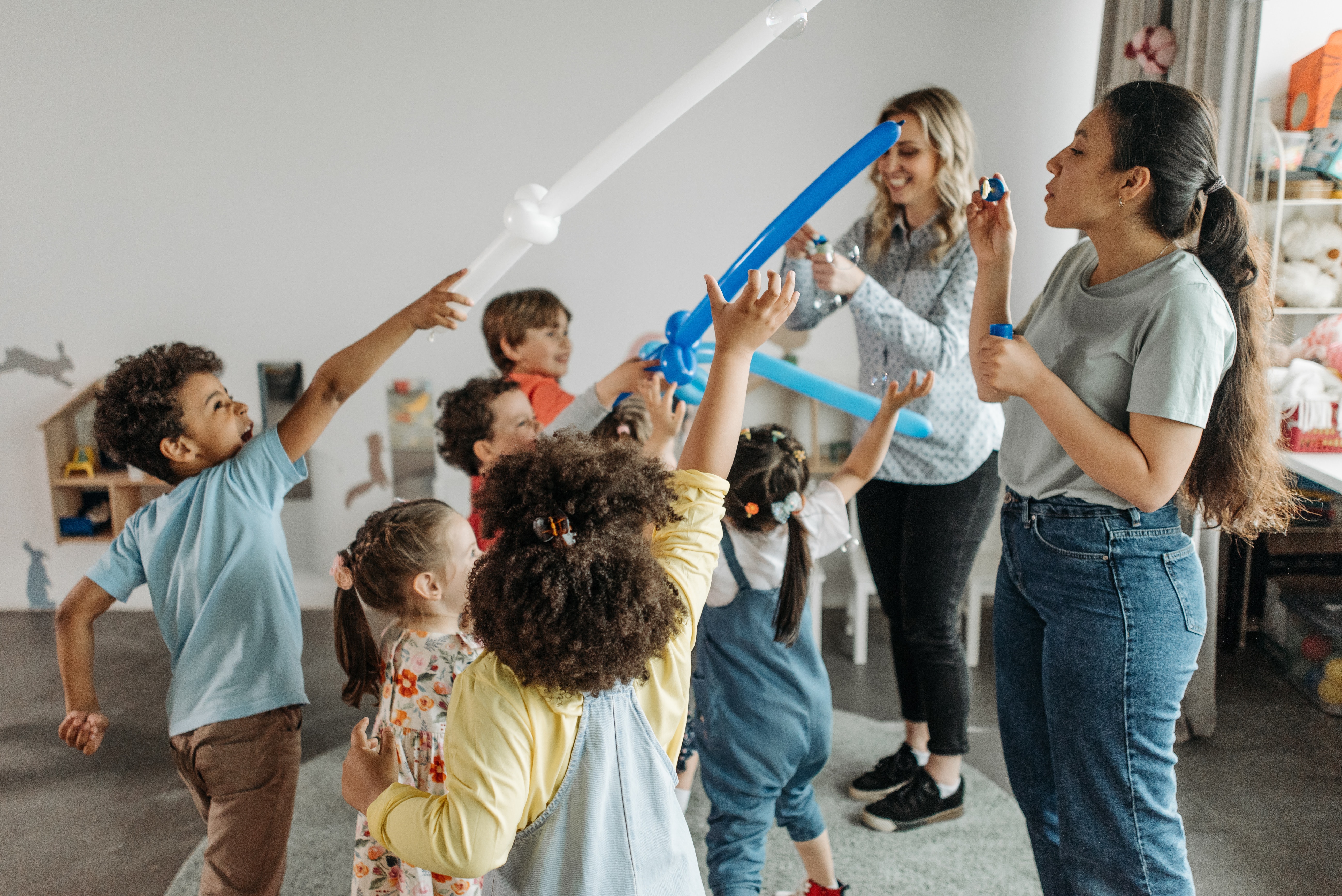 Children using balloons as props