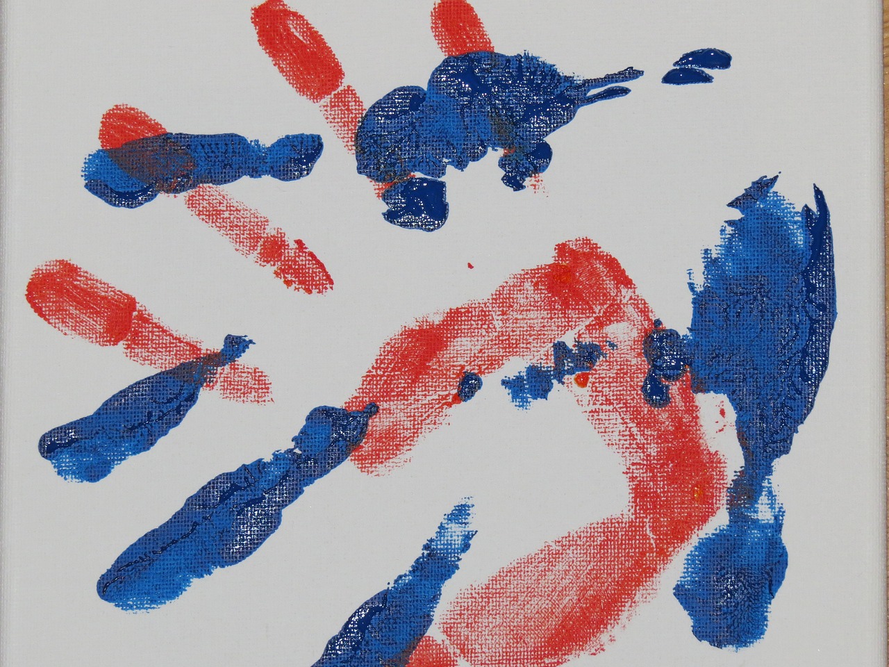 Overlapping hand prints in paint