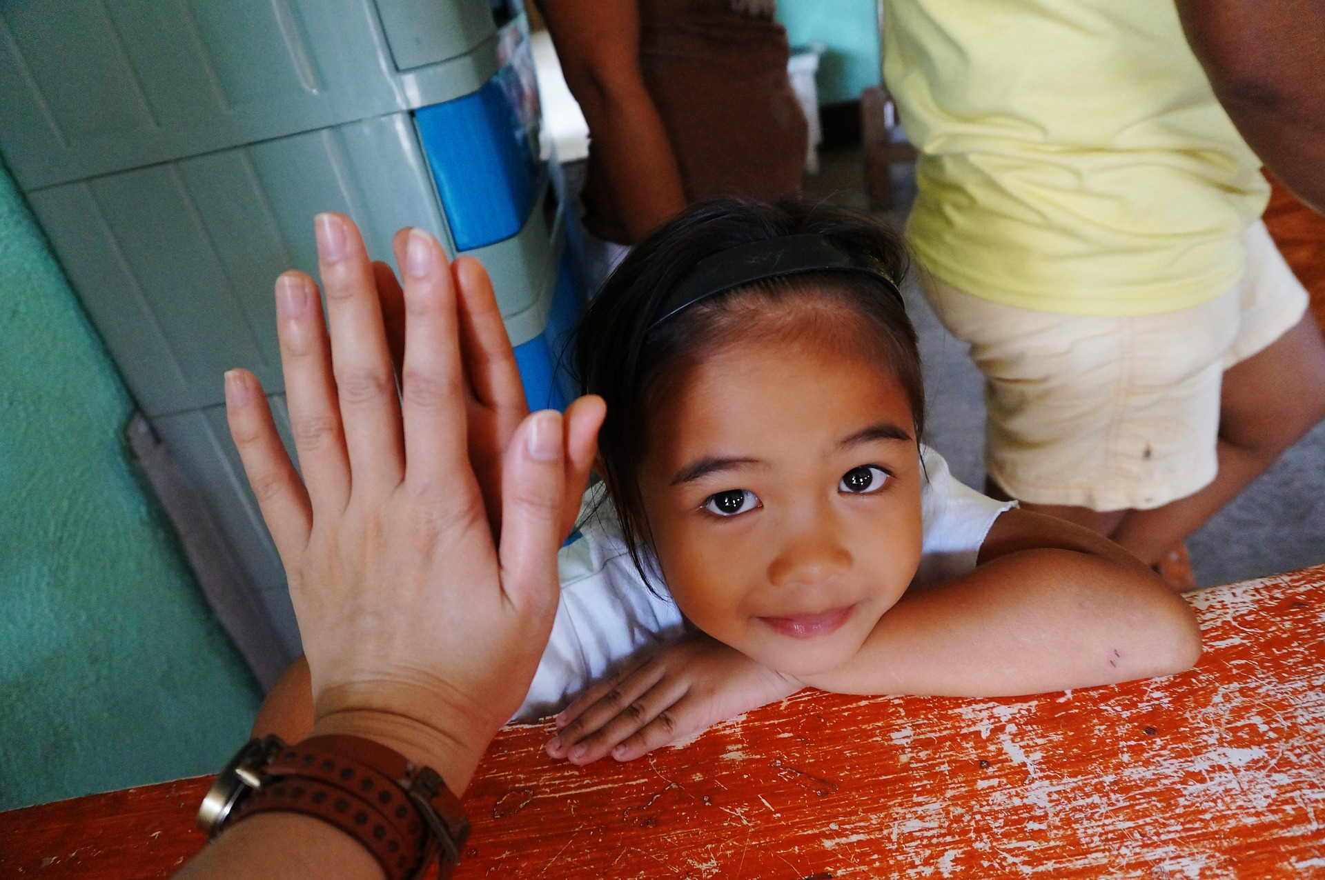 Child being congratulated by an adult